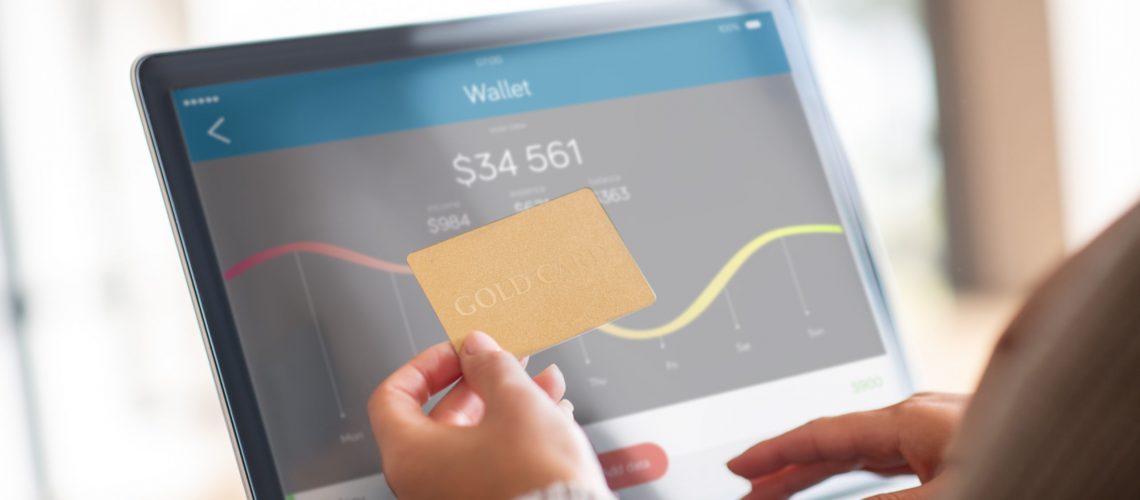 Close Up Of Woman Checking Balance Of Bank Account Online - J L ASSESSORIA